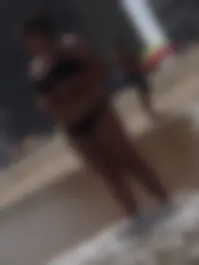 Thick beach girl in black bikini with big ass and tits