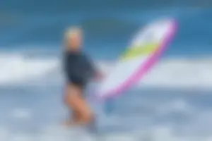 Candid girls surfing on the beach