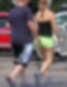 Blonde girl in glasses with a thick booty in green shorts