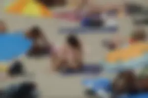 Girls on a nude beach in Sitges, Spain
