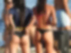 Fit girl with nice body in thong bikini on the beach