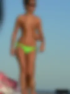 Bunch of sexy babes on the beach topless and in thong bikinis