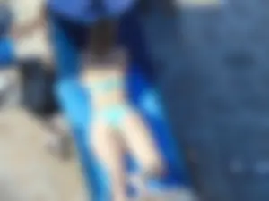 Hot Girl in Blue Swimsuit Lying on Stomach on Sunbed