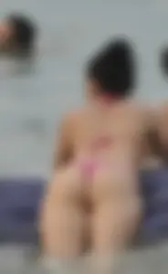 Girl With Fit Ass Climbing Onto a Swimming Mattress at the Beach Candid Pic