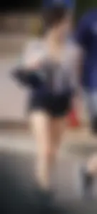 Cutie walking her dog in short denim shorts and showing a bit of cheek