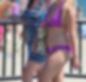 Sexy thick blonde girl in purple bikini