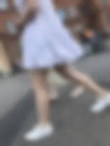 Young candid girl in a white dress, hot legs