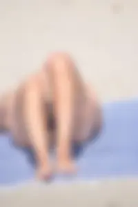 Blue bikini girl on the beach with a great ass and a little pussy lips slips