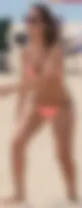 Girl in peach bikini on the beach with a great body and great ass