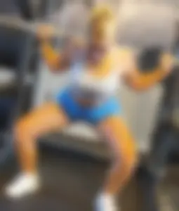 Small blonde pawg in light blue pants squatting as low as she can. Frontal view. OC