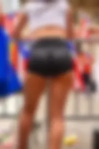 Girl With Amazing Ass in Spandex Shorts and Hot Legs on the Street Rally Creepshot
