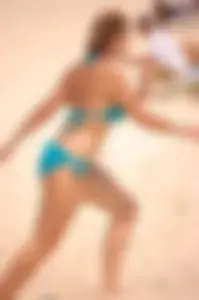 Assortment of sexy babes at the beach in bikinis