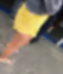 Skinny ass eating her yellow shorts