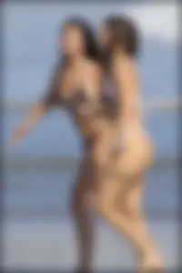 Two sexy ass friends at the beach in thong bikinis