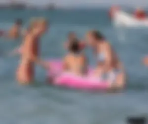 A bunch of sexy beach voyeur babes in bikinis, thongs and topless