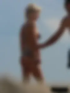 Tattooed blonde with big tits topless and in thong