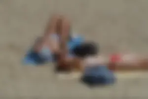 Girls on a nude beach in Sitges, Spain