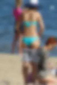Couple of hot babes hanging out at the beach in bikinis