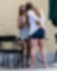 Sexy girl in a tiny grey skirt with decent ass
