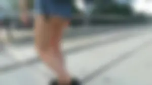 Girl walking in denim shorts showing some of her ass cheeks
