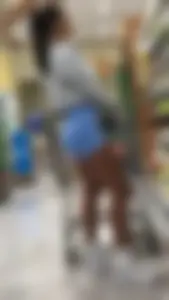 Latina Lady Lumps in blue spandex shorts