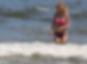 Two sexy beach teens in bikinis, one thick and one skinny with big boobs
