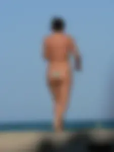 2 topless thonged sexy friends on the beach with great bodies