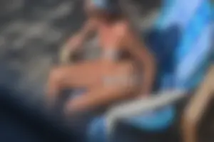 Creepshots of a neighbor milf in a bikini while sunbathing