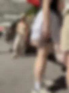 Closeups of a hot girl’s pale legs, she’s wearing a skirt