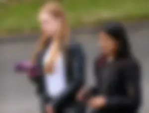 Redhead and ethnic skinny teens in tight jeans
