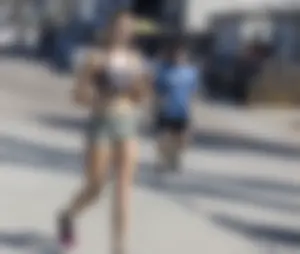 Hot candid jogger wearing a crop top and spandex shorts street creepshot