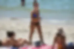 Sexy ass girl with a perfect body in her bikini on the beach