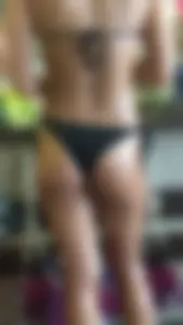 Oiled up thong bikini in store