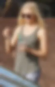 Hot blonde in light leggings after getting Starbucks