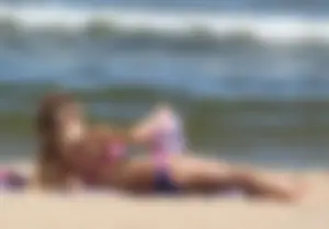 Two sexy beach teens in bikinis, one thick and one skinny with big boobs