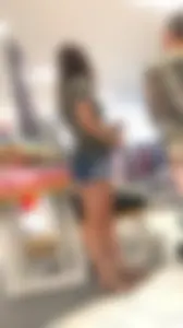 Brunette babe in denim shorts with a sexy ass and legs