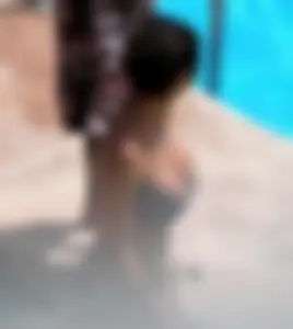 Sexy pool teen with big boobs barely staying in her top