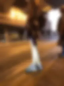 Cute Teen in Shorts on the Tram Stop