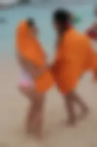 Couple PAWGs on the beach in bikinis partying