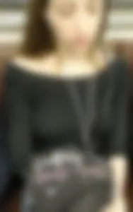 Very cute candid girl sitting in a subway train with her headphones