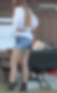 Hippie type dressed girl in denim shorts with a nice ass