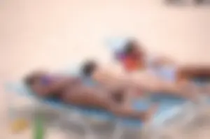 Assortment of sexy babes at the beach in bikinis