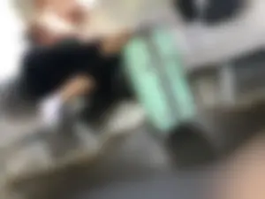 Hot Girlfriend in Pants And White, Slightly Dirty Socks, Her Sneakers Taken Off, Chilling on the Train Seat With Her Head on Her Boyfriend's Lap