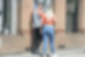 Blonde in skintight jeans shopping with boyfriend