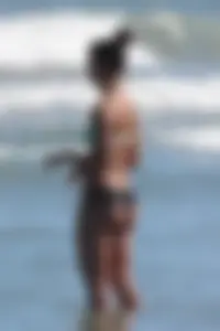 Beach girl out in a bikini with a nice round big booty