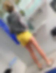 Skinny ass eating her yellow shorts
