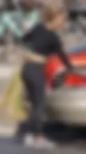 Sexy ass blonde in the parking lot in leggings with amazing body