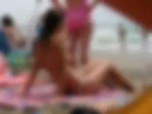 Hot topless girl on the beach in a thong bikini with a nice ass