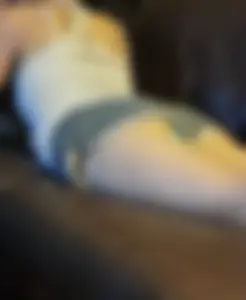Girl in Short Shorts Lying on the Couch in Various Poses, Her Panties Occasionally Flashing