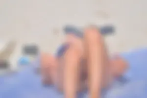 Blue bikini girl on the beach with a great ass and a little pussy lips slips